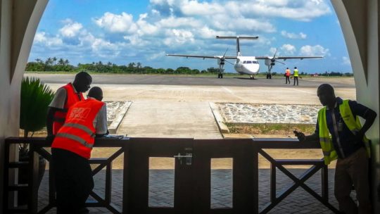 Airport in Malindi with Airplane on runaway and operators at work