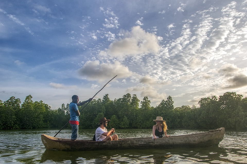 Canoeing at Mida Creek on wooden canoe Canoeing at Mida Creek on wooden canoe